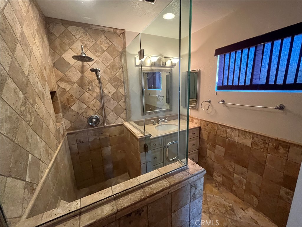 4811 Cathy Avenue Cypress, CA 90630 - Photo 13 of 23 a bathroom with a bathtub and a sink