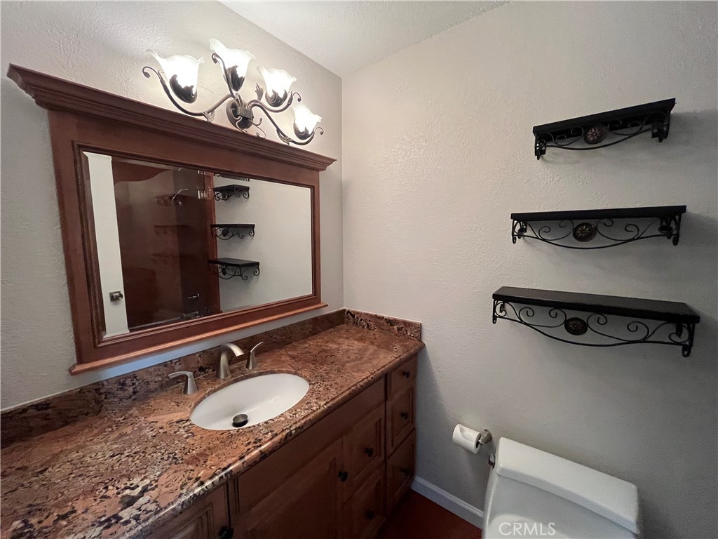 4811 Cathy Avenue Cypress, CA 90630 - Photo 18 of 23 a bathroom with a sink and a mirror