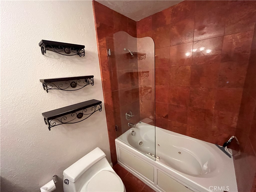 4811 Cathy Avenue Cypress, CA 90630 - Photo 19 of 23 a bathroom with a tub and a shower