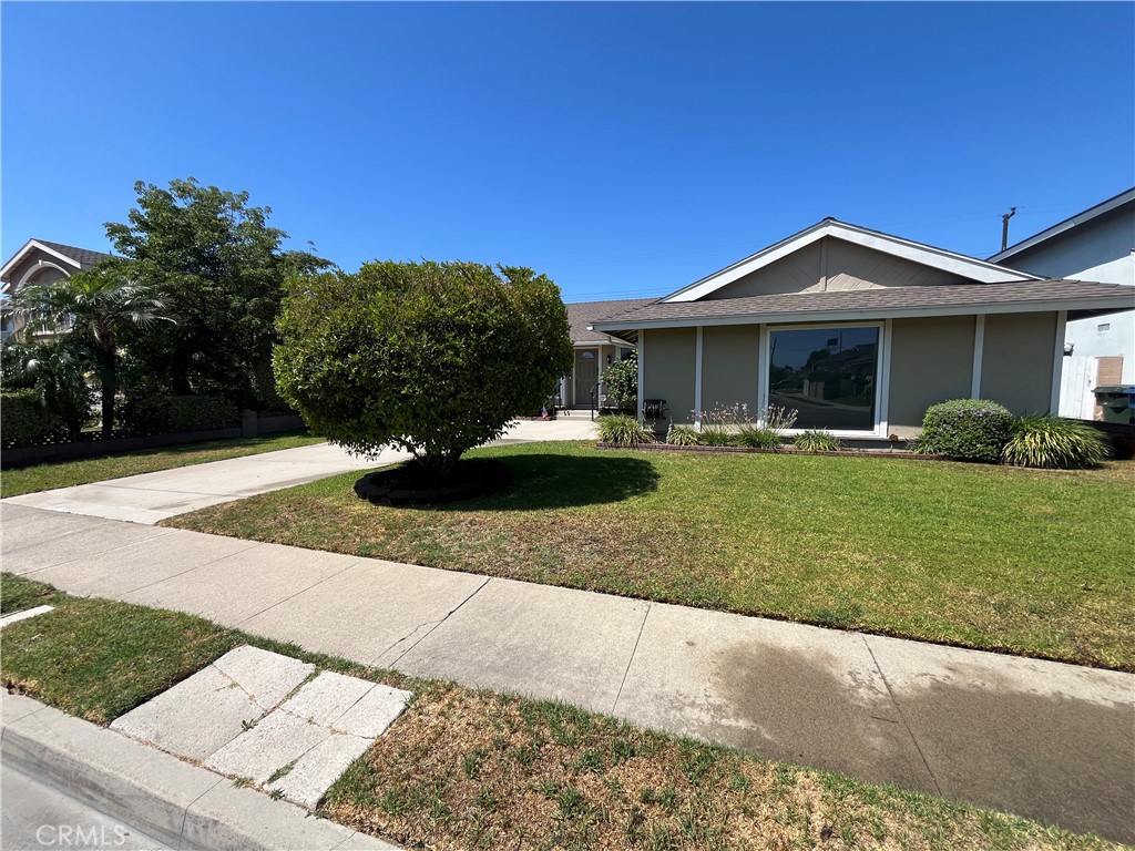 4811 Cathy Avenue Cypress, CA 90630 - Photo 2 of 23 a front view of a house with a yard and garage