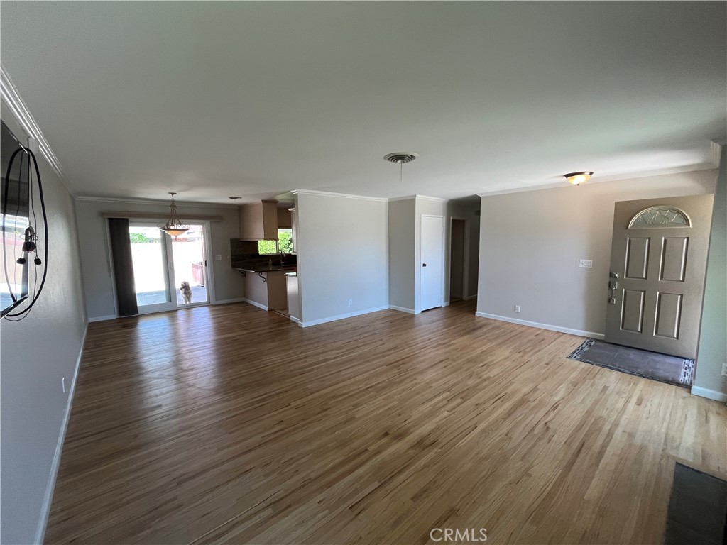 4811 Cathy Avenue Cypress, CA 90630 - Photo 5 of 23 a view of a livingroom with wooden floor and stairs