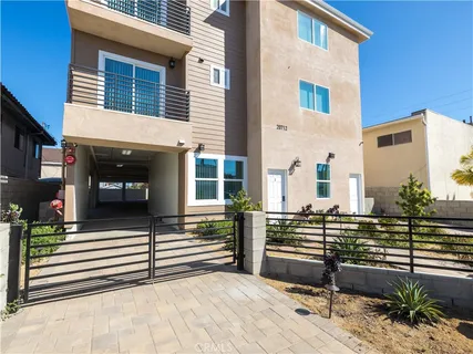 a view of a terrace with a chair and tables