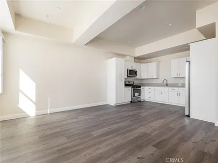a view of kitchen with wooden floor
