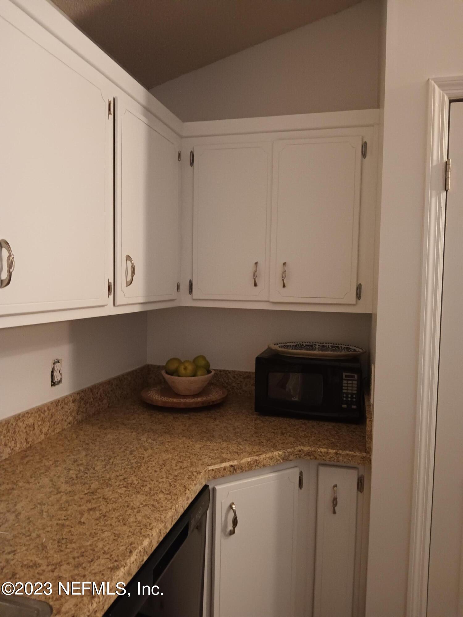 97612 Pirates Point Road Yulee, FL 32097 - Photo 15 of 23 a kitchen with a sink and cabinets