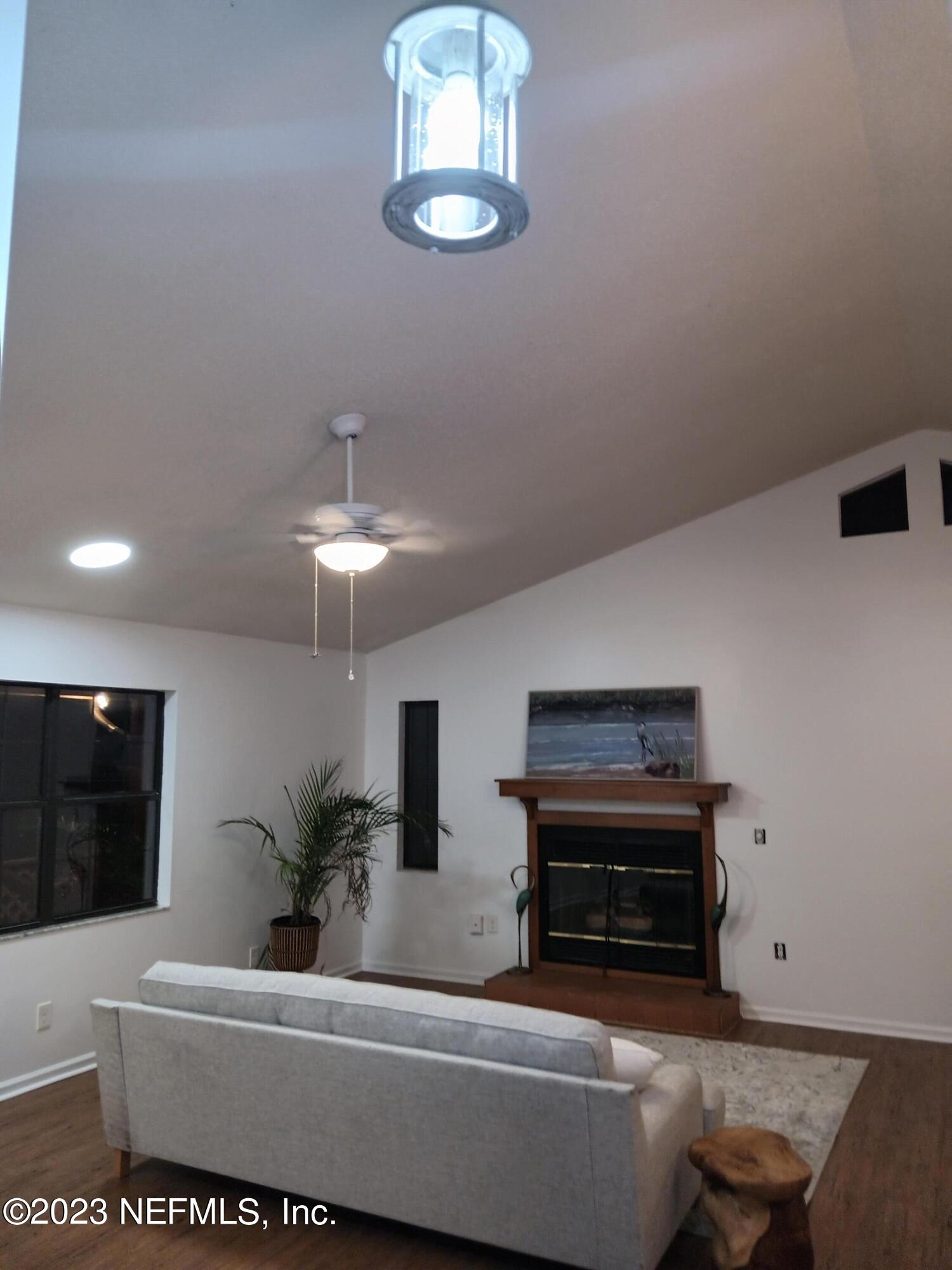 97612 Pirates Point Road Yulee, FL 32097 - Photo 2 of 23 a living room with furniture and a potted plant