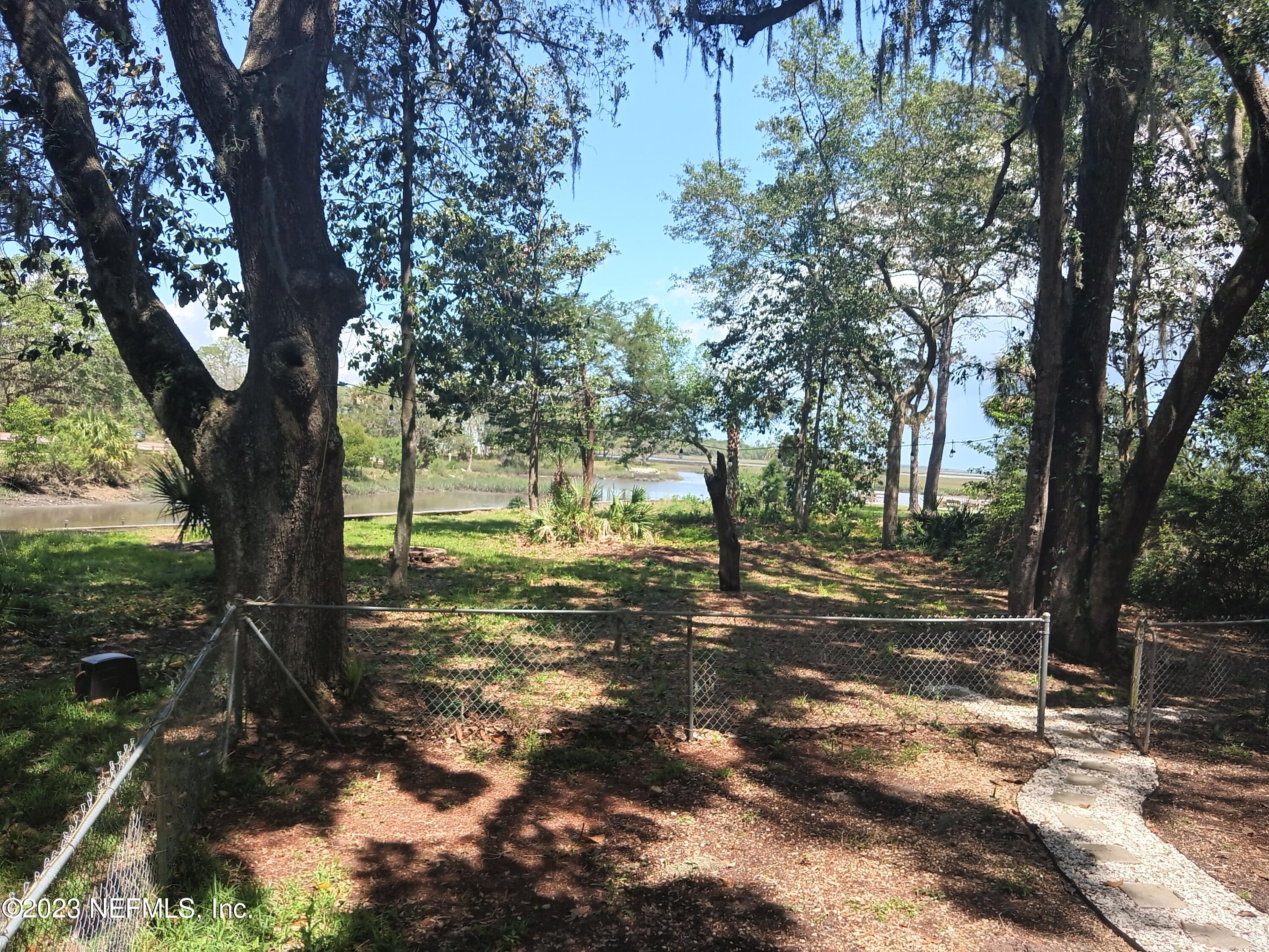 97612 Pirates Point Road Yulee, FL 32097 - Photo 23 of 23 a view of a yard with a tree