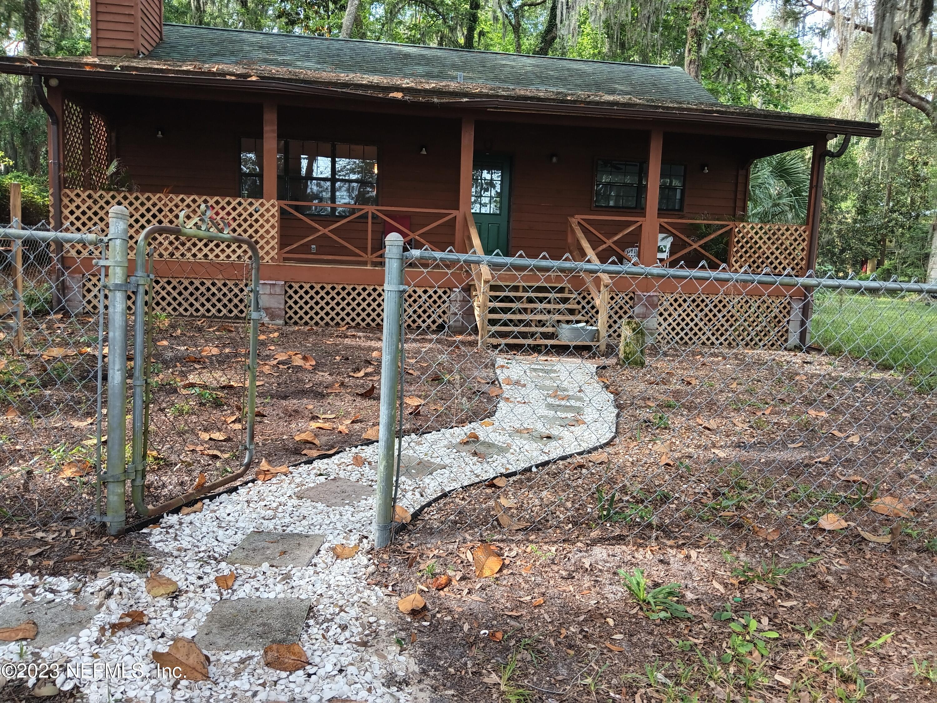 97612 Pirates Point Road Yulee, FL 32097 - Photo 10 of 23 a view of a house with a porch