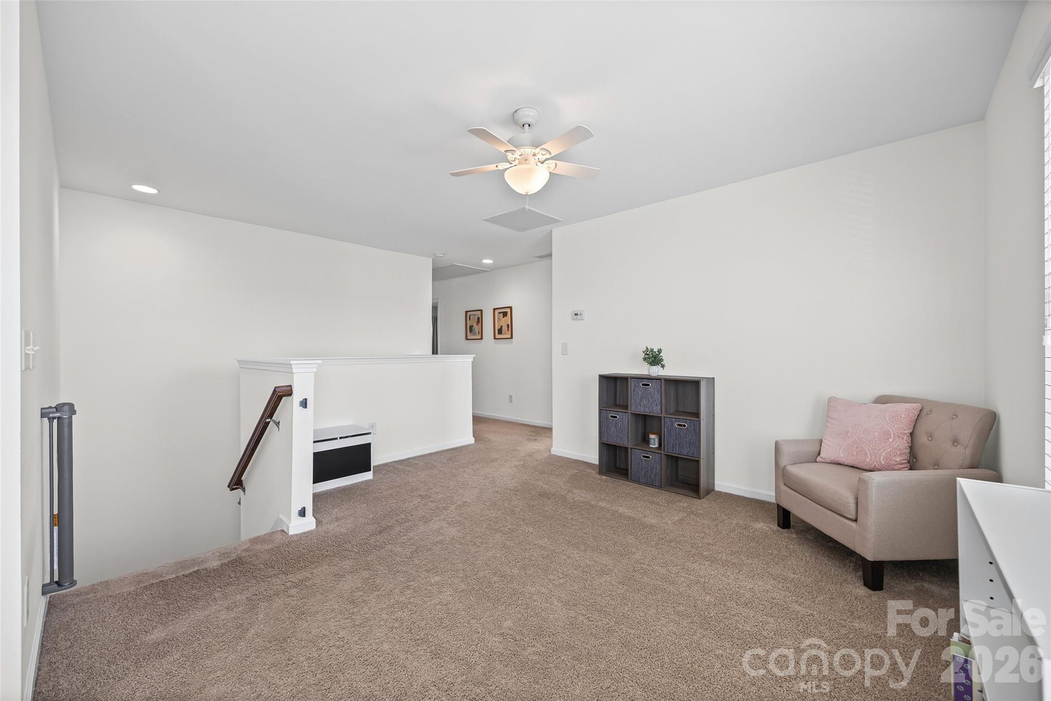 4470 Haddington Drive Indian Land, SC 29707 - Photo 13 of 27 a living room with furniture and a fireplace