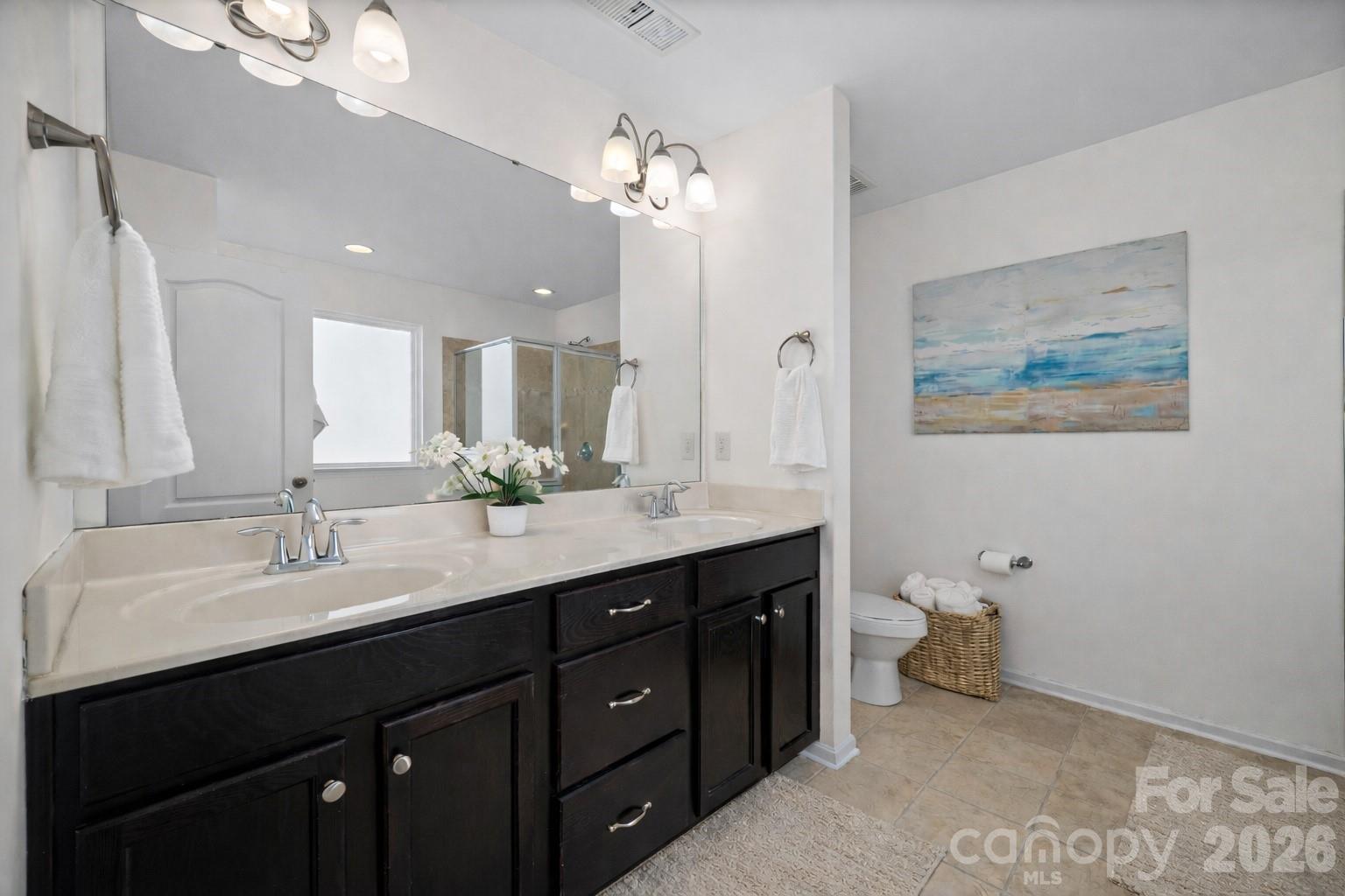 4470 Haddington Drive Indian Land, SC 29707 - Photo 16 of 27 a spacious bathroom with a double vanity sink and a mirror