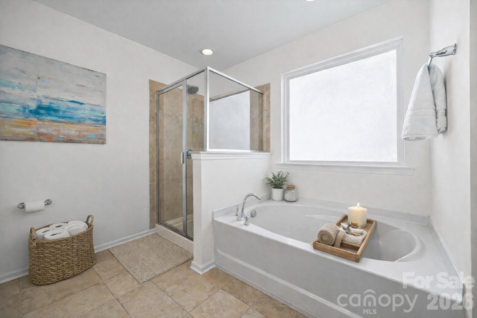 4470 Haddington Drive Indian Land, SC 29707 - Photo 17 of 27 a bathroom with bathtub and window
