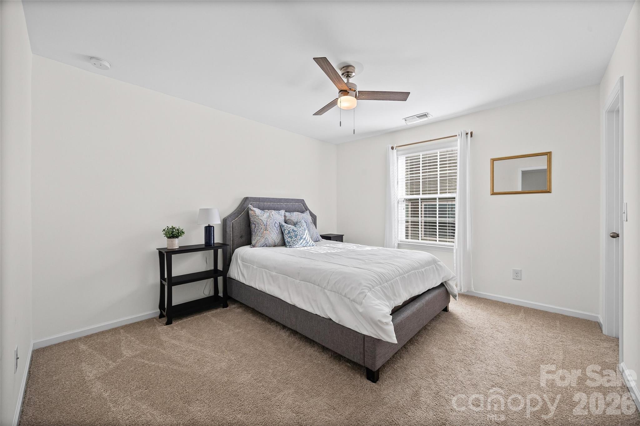 4470 Haddington Drive Indian Land, SC 29707 - Photo 18 of 27 a bedroom with a bed and window