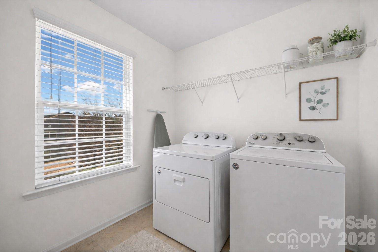 4470 Haddington Drive Indian Land, SC 29707 - Photo 22 of 27 a view of storage and utility room with washer and dryer