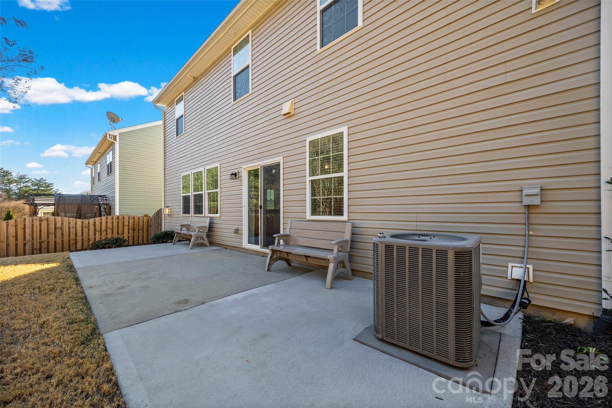 4470 Haddington Drive Indian Land, SC 29707 - Photo 23 of 27 a view of a patio with table and chairs and wooden fence