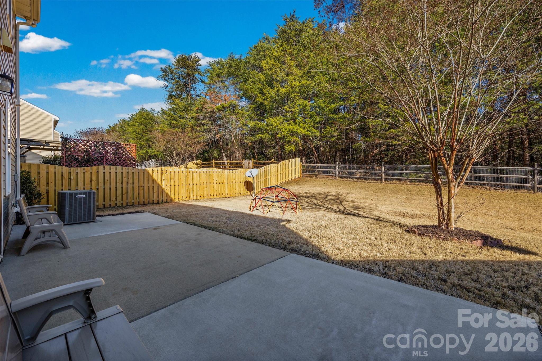 4470 Haddington Drive Indian Land, SC 29707 - Photo 24 of 27 a view of a yard with wooden fence