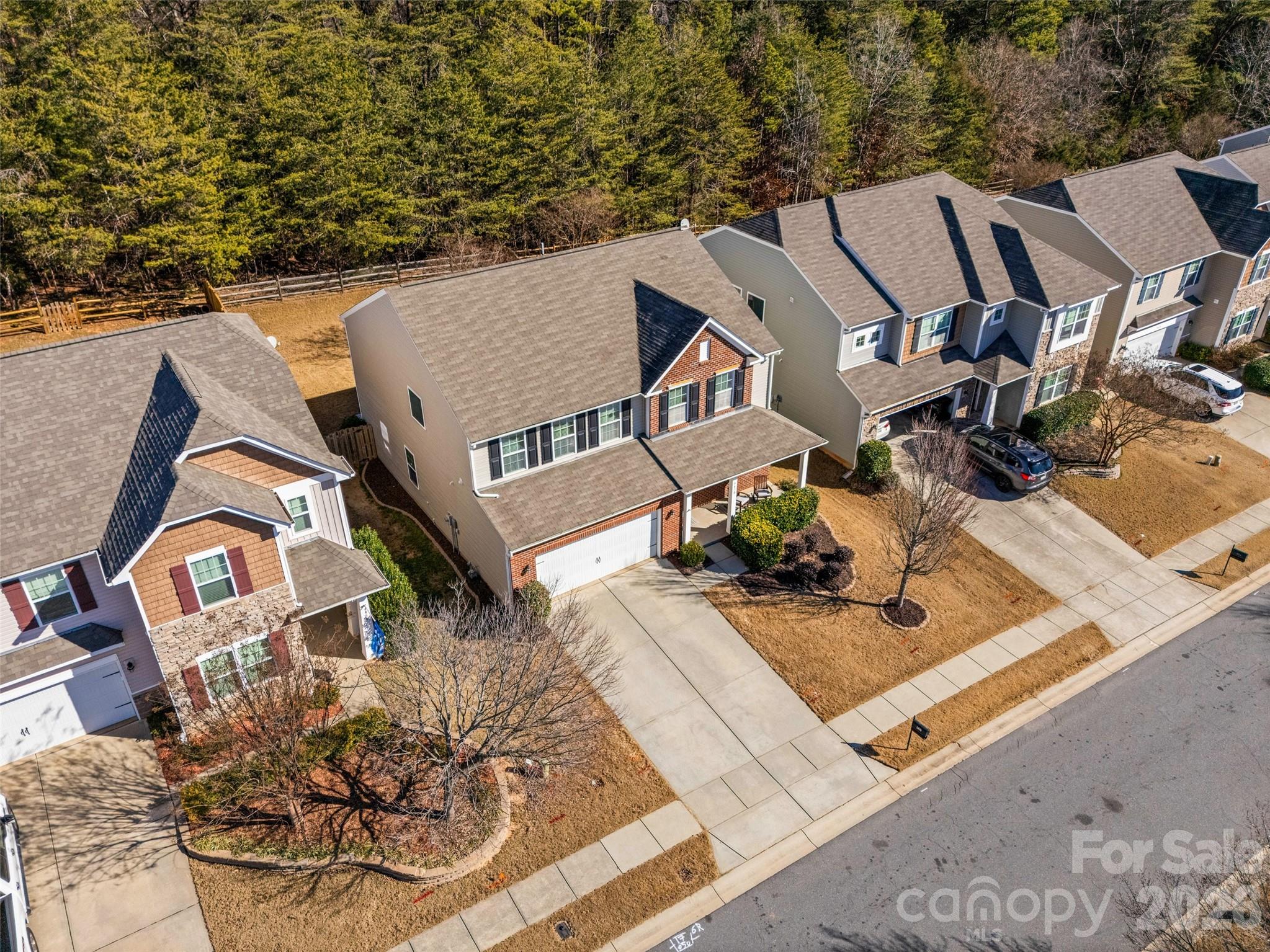 4470 Haddington Drive Indian Land, SC 29707 - Photo 25 of 27 an aerial view of a house with large trees