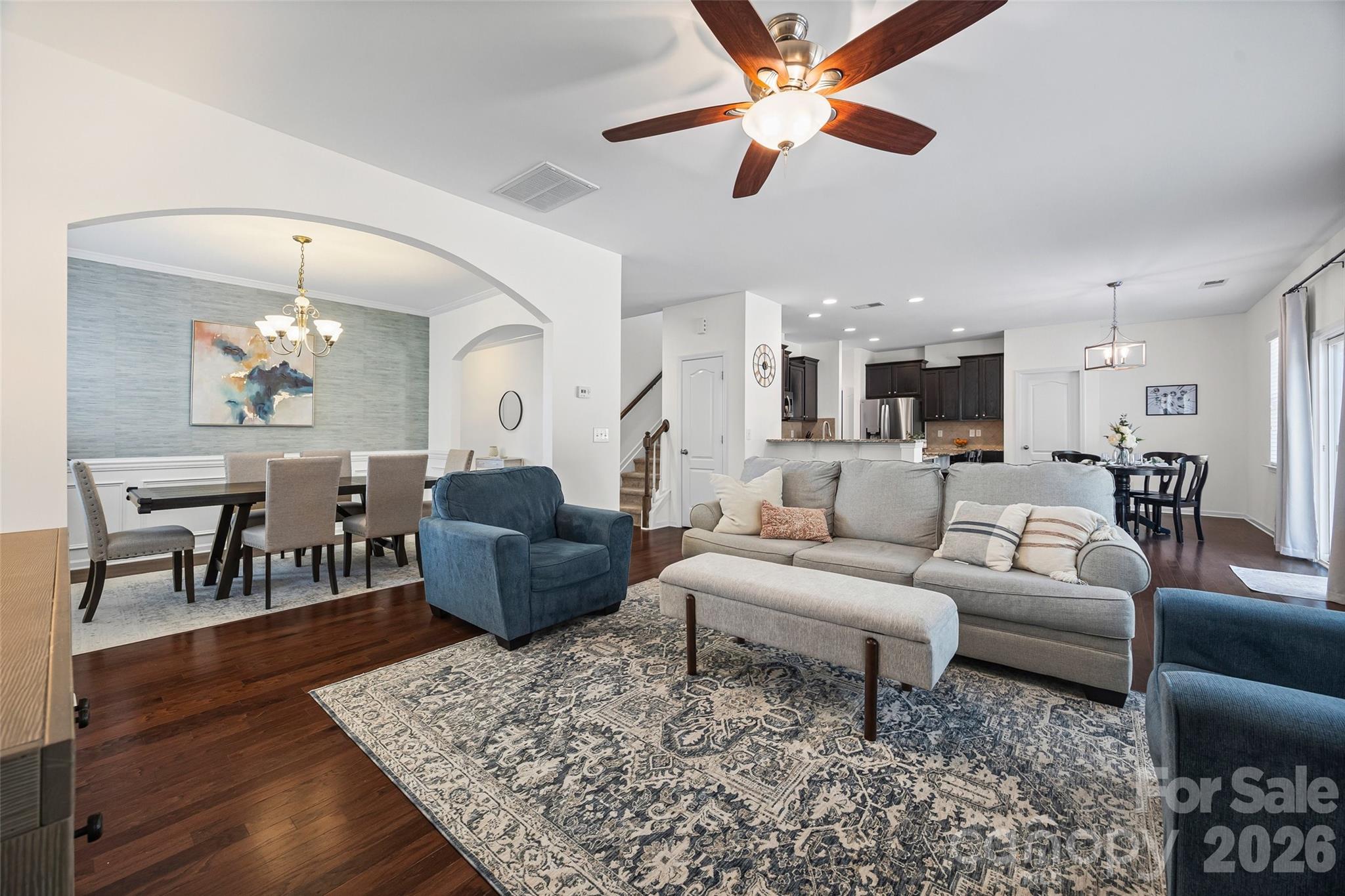 4470 Haddington Drive Indian Land, SC 29707 - Photo 7 of 27 a living room with furniture and a chandelier