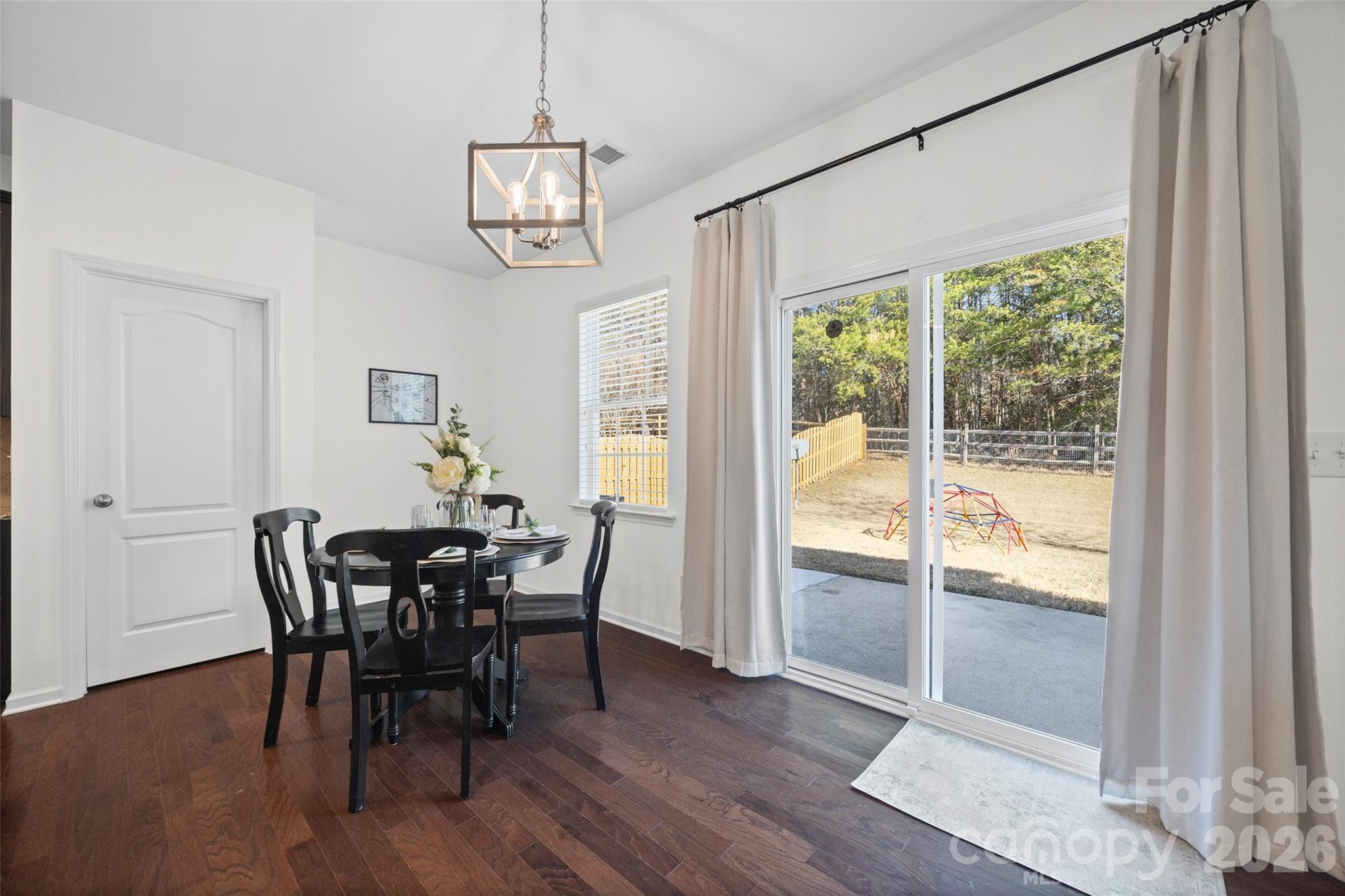 4470 Haddington Drive Indian Land, SC 29707 - Photo 9 of 27 a view of a dining room with furniture window and wooden floor