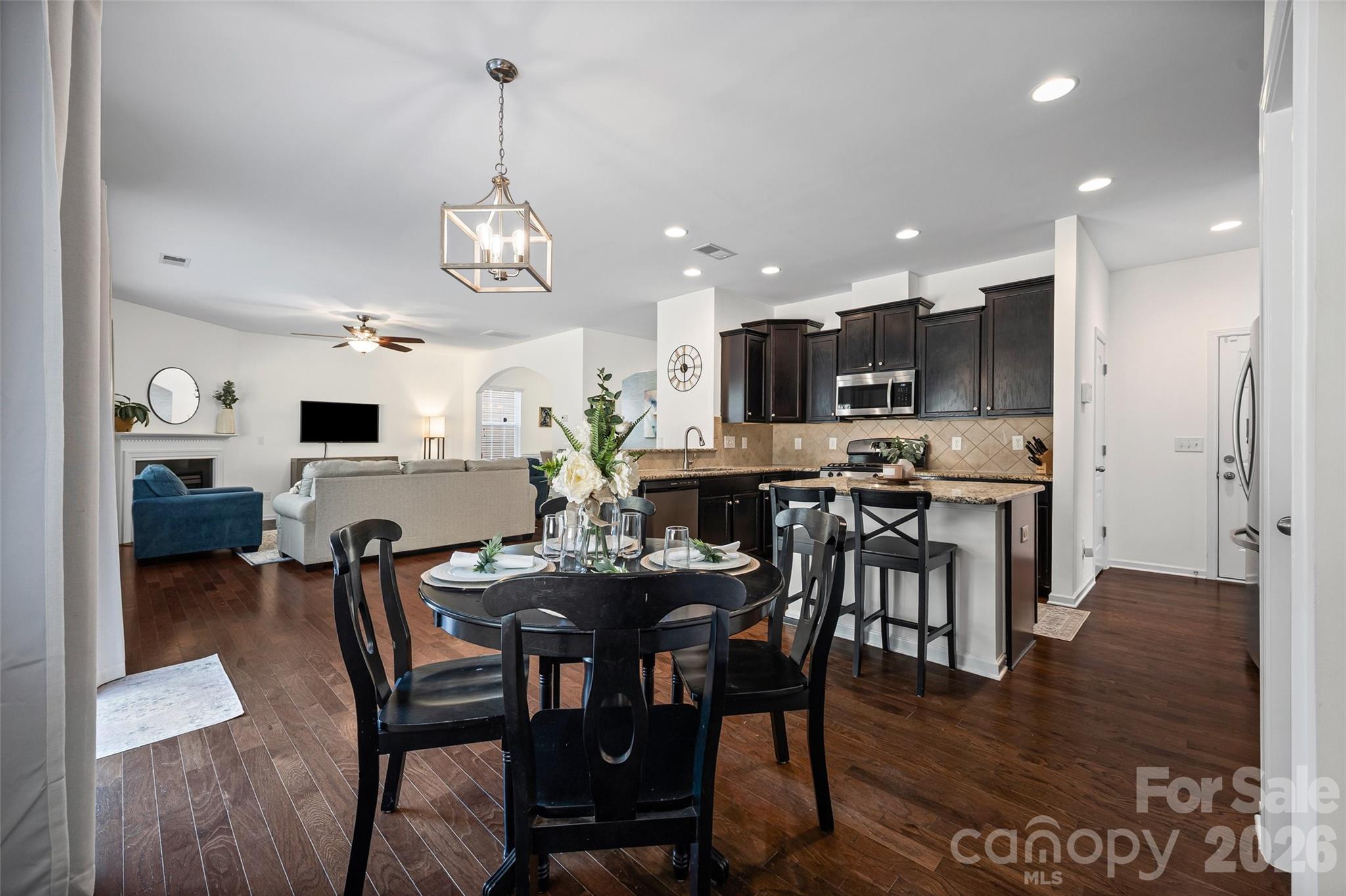 4470 Haddington Drive Indian Land, SC 29707 - Photo 10 of 27 a view of a dining room with furniture and wooden floor