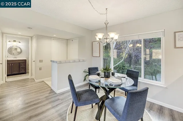 a living room with furniture chandelier and a chandelier