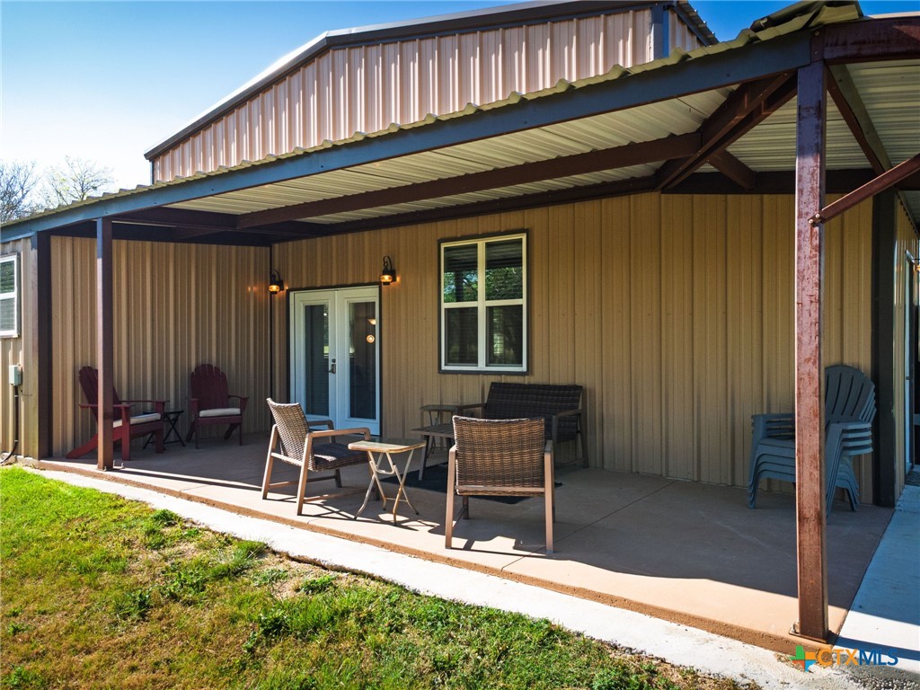 469 Whispering Oaks Loop Killeen, TX 76549 - Photo 28 of 48 a patio with table and chairs