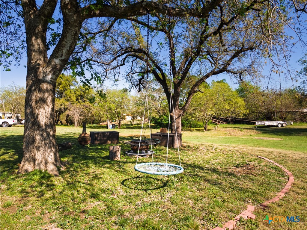 469 Whispering Oaks Loop Killeen, TX 76549 - Photo 36 of 48 a view of a lake with a table and chairs