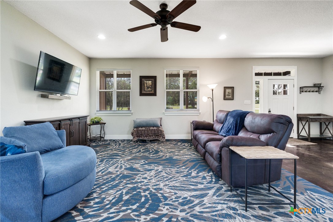 469 Whispering Oaks Loop Killeen, TX 76549 - Photo 8 of 48 a living room with furniture and a flat screen tv