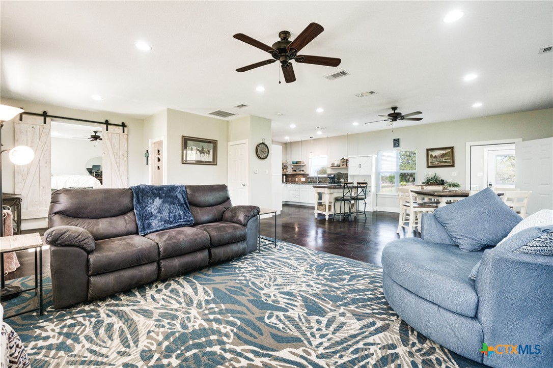 469 Whispering Oaks Loop Killeen, TX 76549 - Photo 9 of 48 a living room with furniture and kitchen view