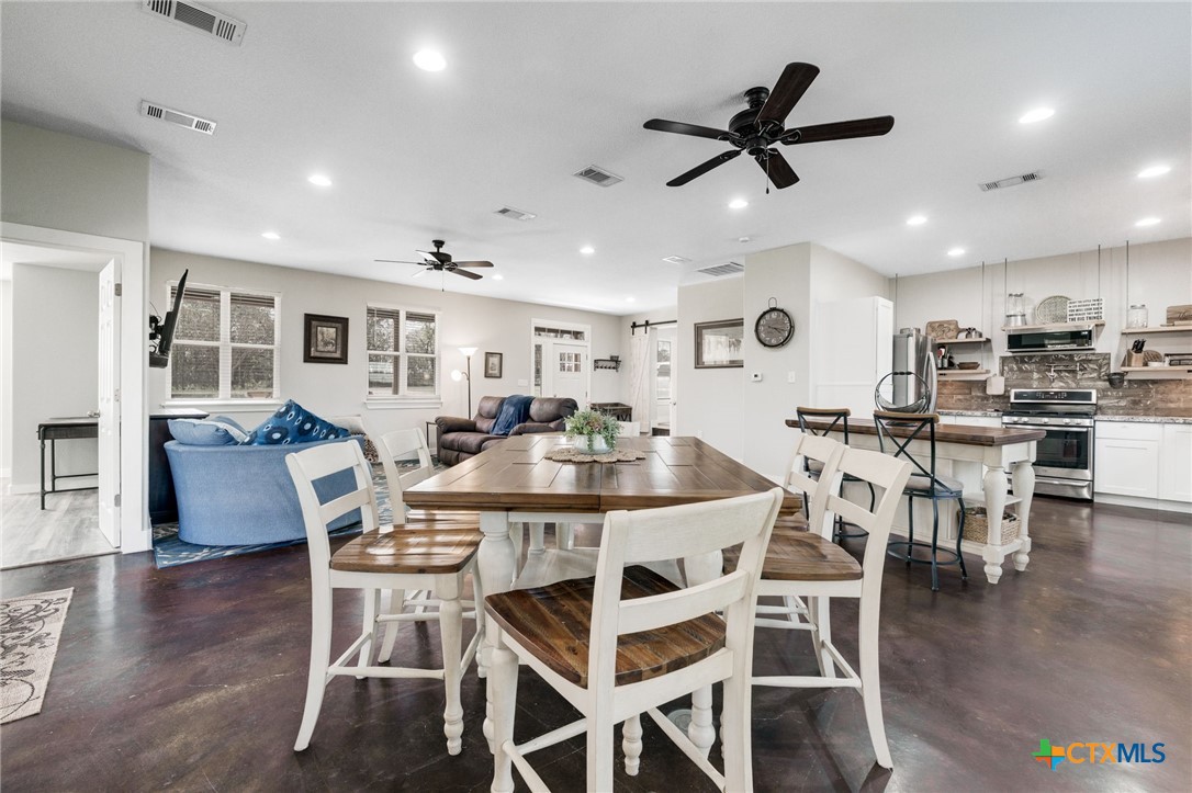 469 Whispering Oaks Loop Killeen, TX 76549 - Photo 10 of 48 a view of a dining room with furniture and wooden floor