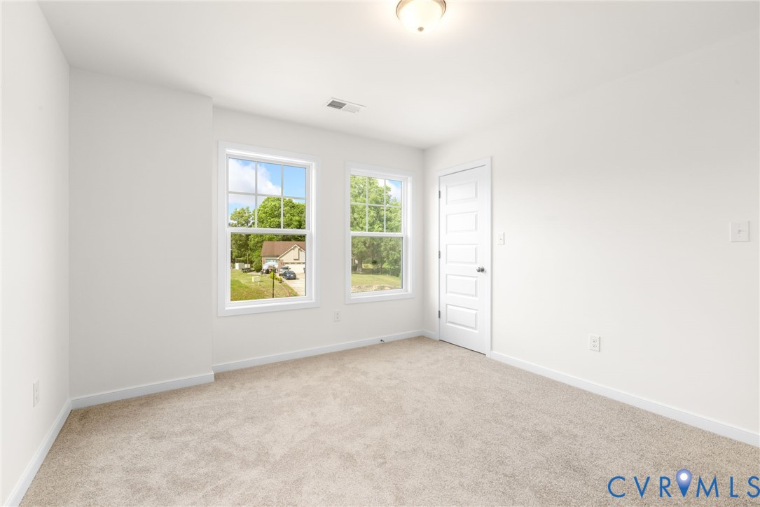 104 Pine Ridge Lane Farmville, VA 23901 - Photo 23 of 29 an empty room with windows