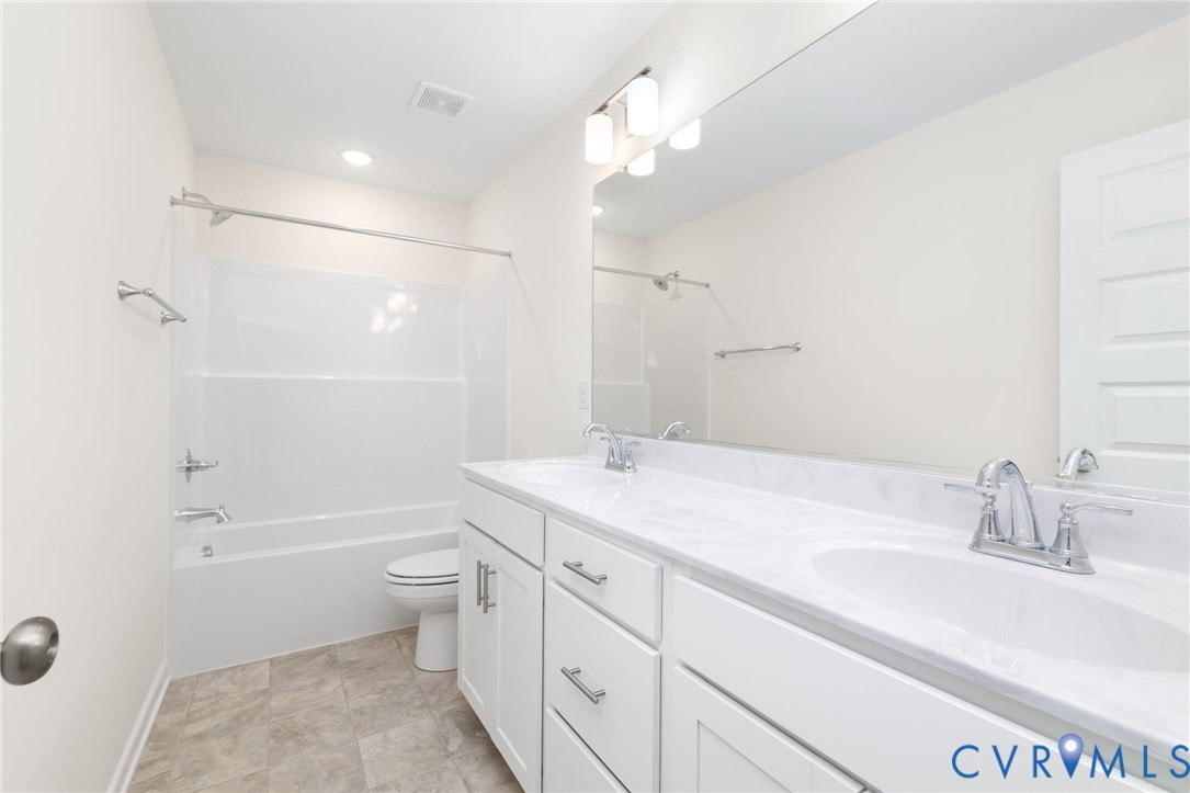 104 Pine Ridge Lane Farmville, VA 23901 - Photo 27 of 29 a bathroom with a sink a toilet and shower