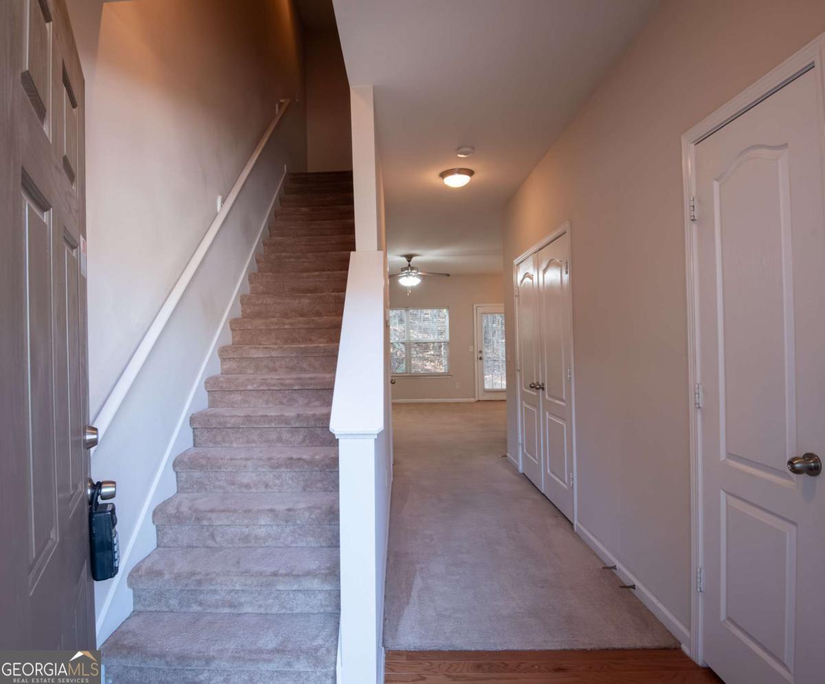 1259 Chinon Point Lithonia, GA 30058 - Photo 15 of 27 a view of a hallway with staircase