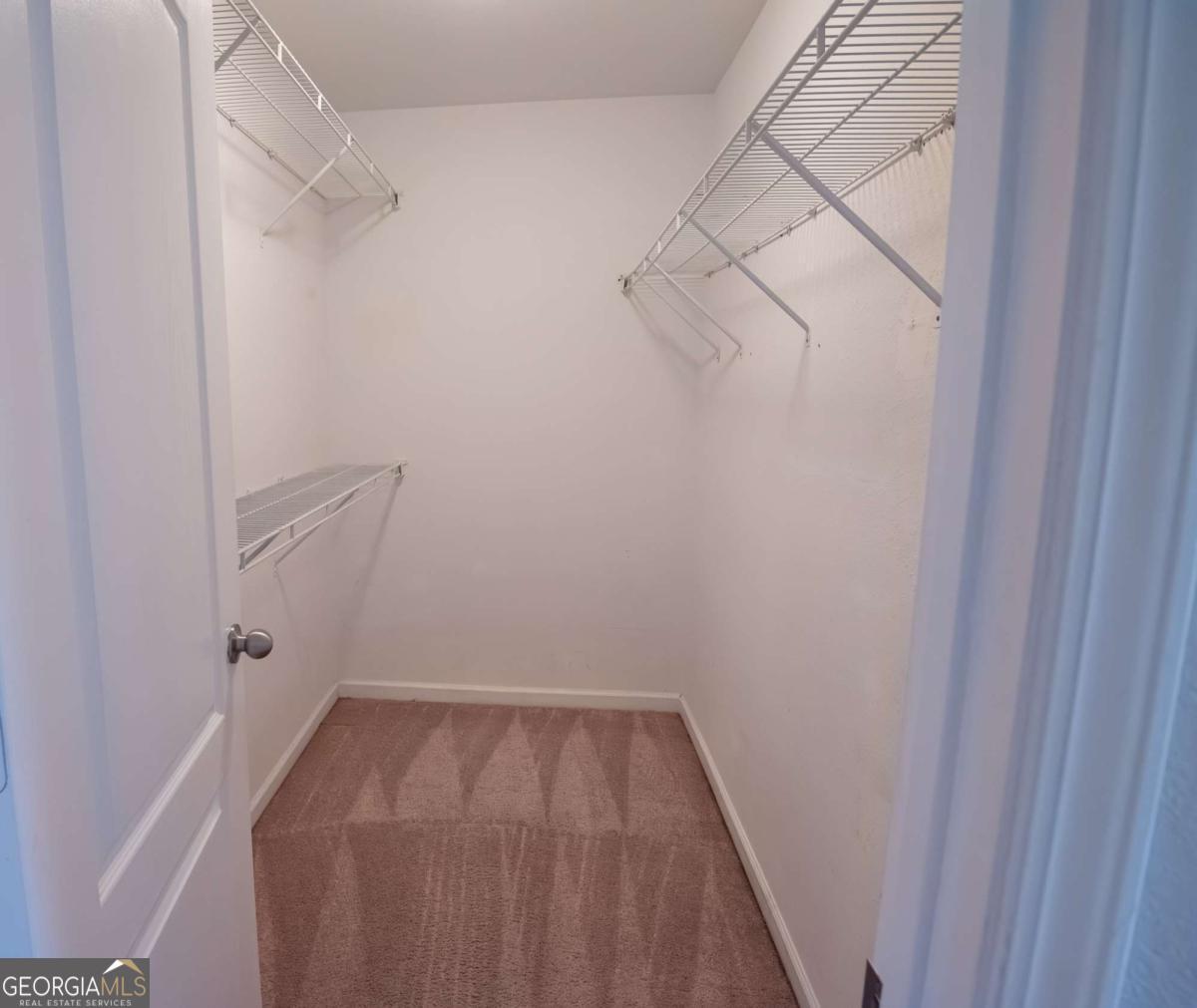 1259 Chinon Point Lithonia, GA 30058 - Photo 20 of 27 a view of a room with racks on the wall