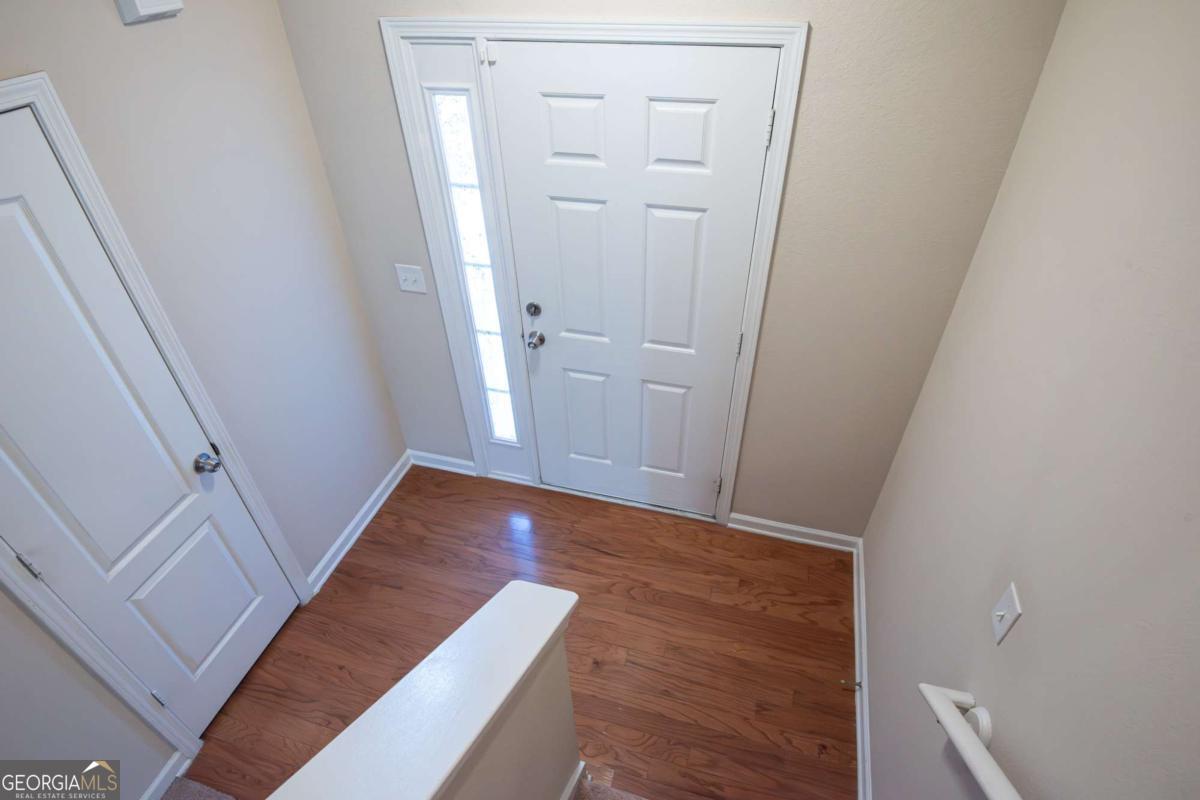 1259 Chinon Point Lithonia, GA 30058 - Photo 2 of 27 wooden floor in an empty room
