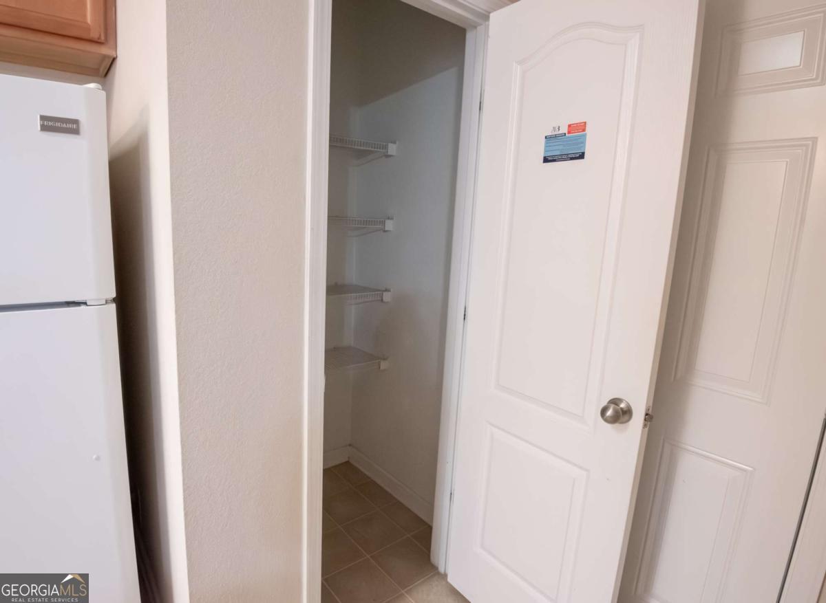 1259 Chinon Point Lithonia, GA 30058 - Photo 7 of 27 a view of a bedroom from a hallway