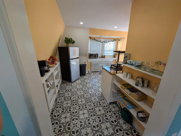 a kitchen with a stove and a refrigerator