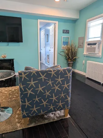 a living room with a couch and a flat screen tv