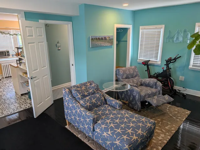 a bedroom with furniture and a window