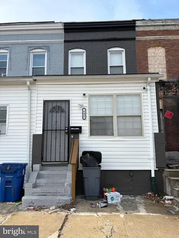 a front view of a house with parking