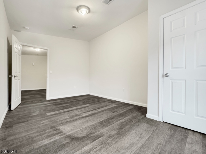 511 South Main Street, Unit 2 Phillipsburg, NJ 08865 - Photo 4 of 9 a view of an empty room with wooden floor