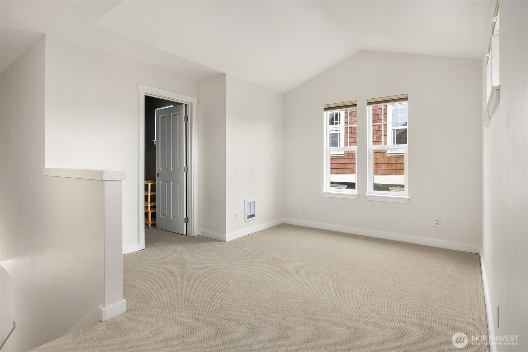 5430 California Avenue Southwest, Unit 2D Seattle, WA 98136 - Photo 14 of 26 an empty room with windows