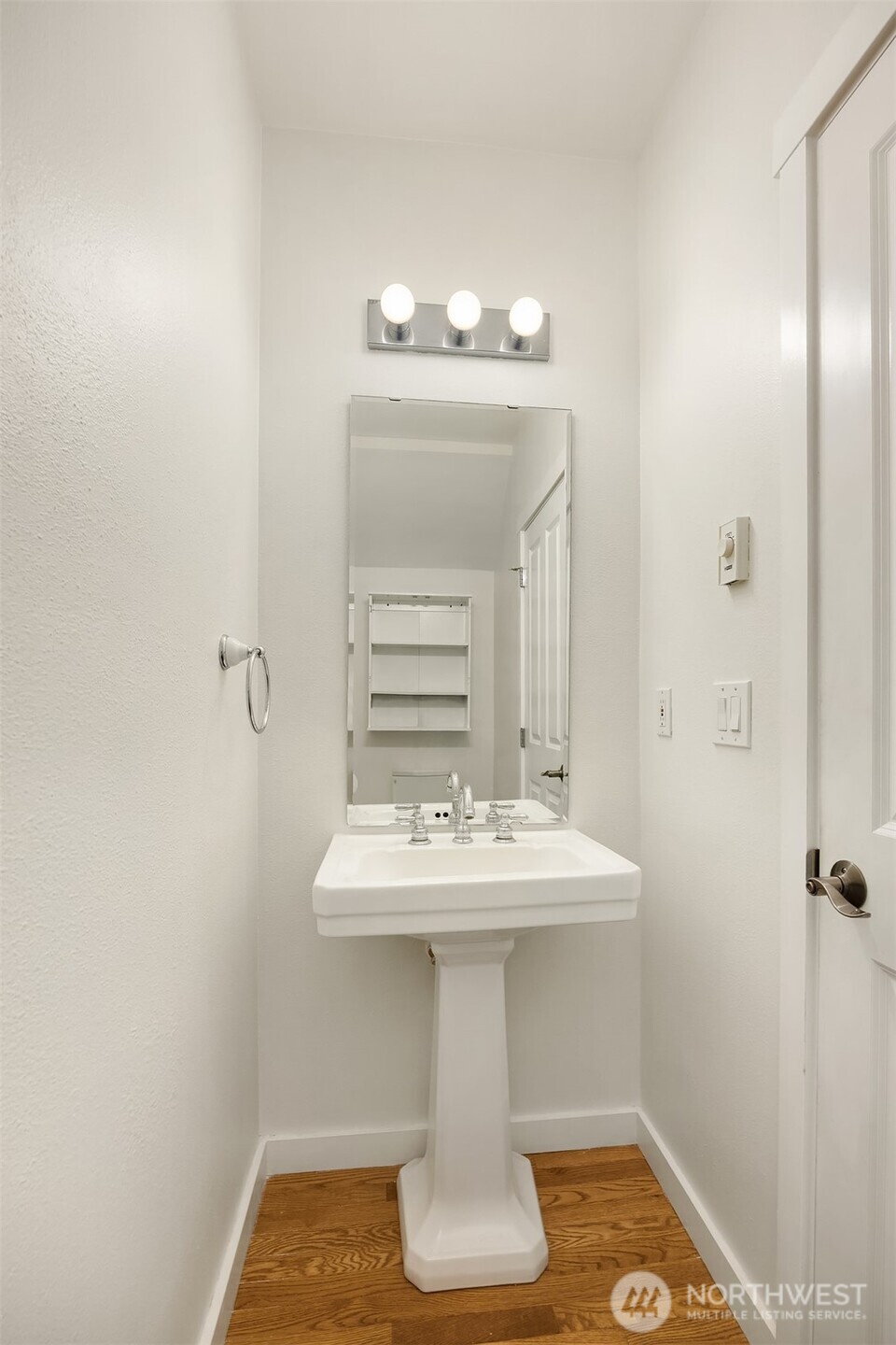 5430 California Avenue Southwest, Unit 2D Seattle, WA 98136 - Photo 7 of 26 a bathroom with a sink and a mirror