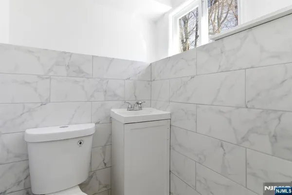 a bathroom with a sink toilet and vanity