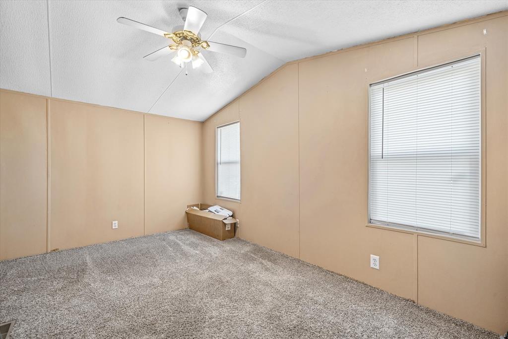 356 Farm To Market Road 751 Wills Point, TX 75169 - Photo 14 of 31 a view of an empty room with window and chandelier fan