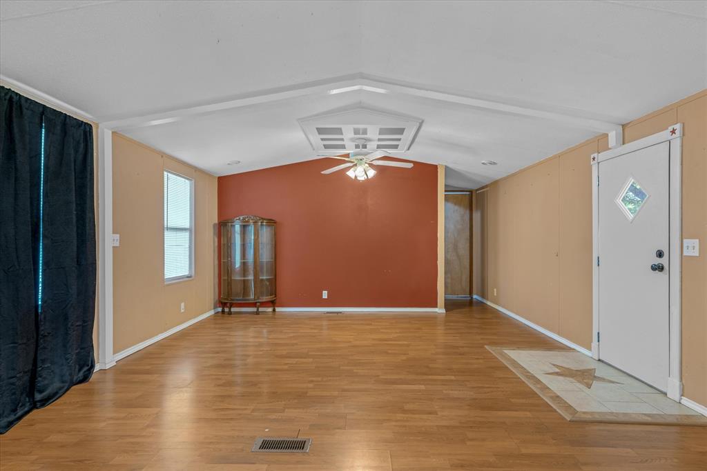 356 Farm To Market Road 751 Wills Point, TX 75169 - Photo 17 of 31 a view of an empty room with window and wooden floor