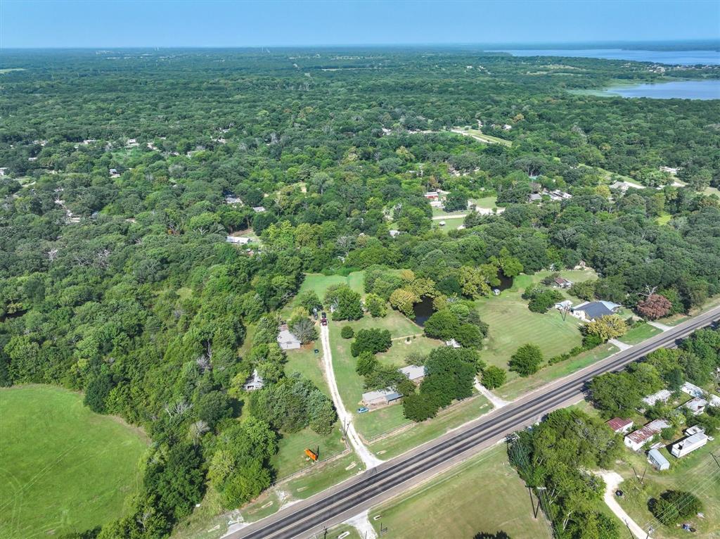 356 Farm To Market Road 751 Wills Point, TX 75169 - Photo 2 of 31 a view of a green field with lots of bushes