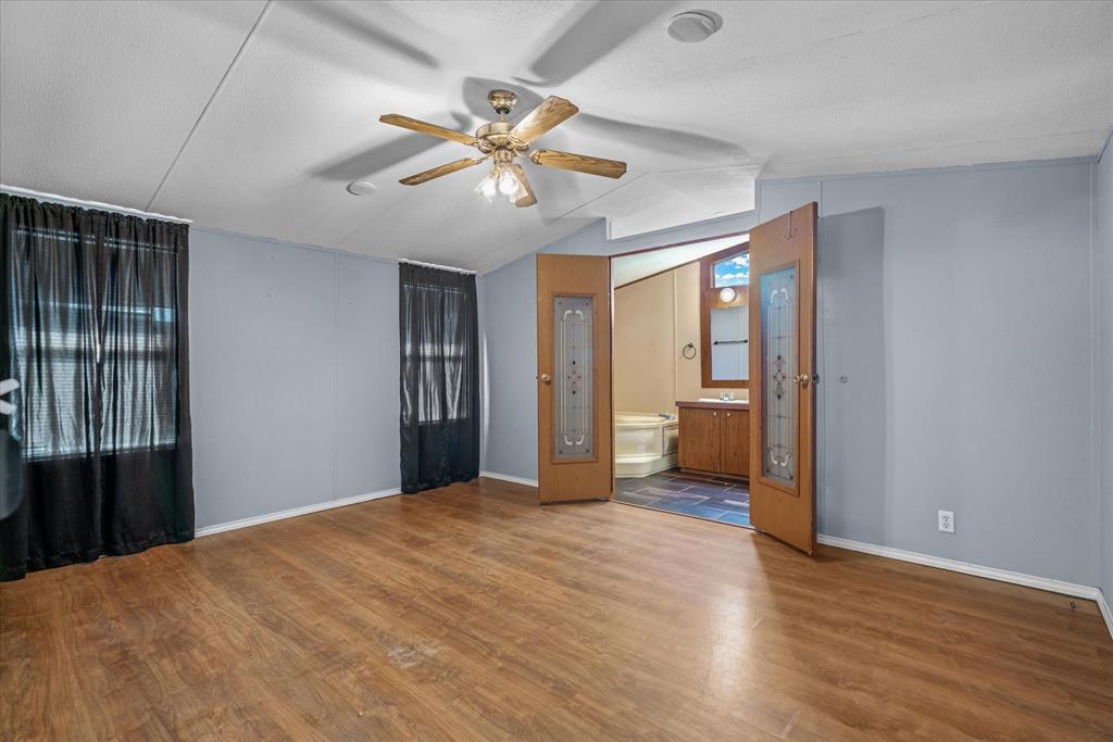 356 Farm To Market Road 751 Wills Point, TX 75169 - Photo 22 of 31 a view of a big room with wooden floor and natural light