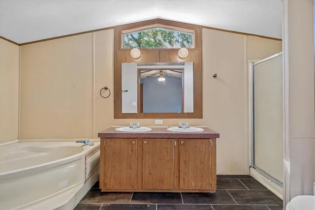 a bathroom with a bathtub and a sink