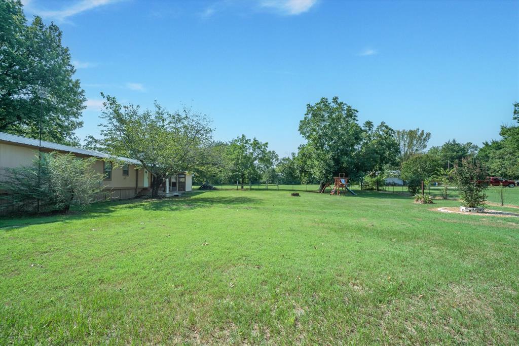 356 Farm To Market Road 751 Wills Point, TX 75169 - Photo 31 of 31 a view of a green field with wooden fence