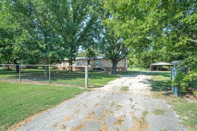 a view of a backyard with a small cabin