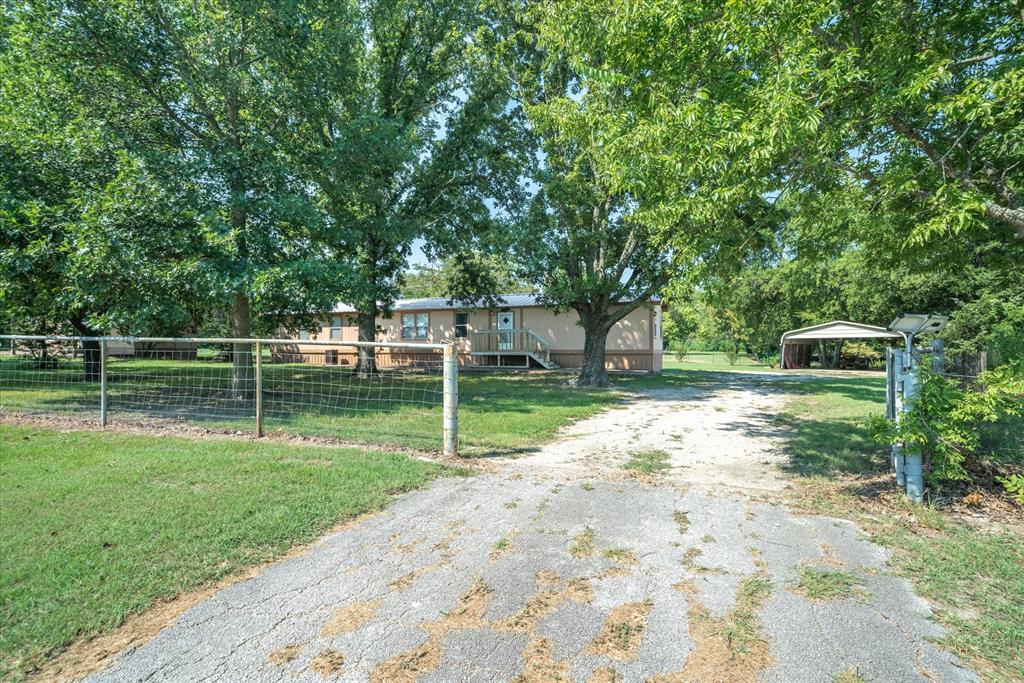 356 Farm To Market Road 751 Wills Point, TX 75169 - Photo 8 of 31 a view of a backyard with a small cabin